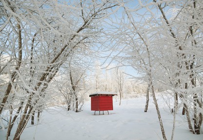 Red beehive in a winter.